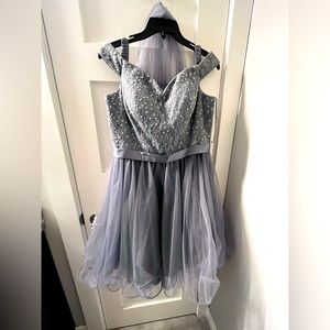 My old grade 8 grad dress. It says it’s grey however I see more of a purple